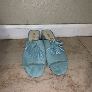 Light blue suede mules with tassels